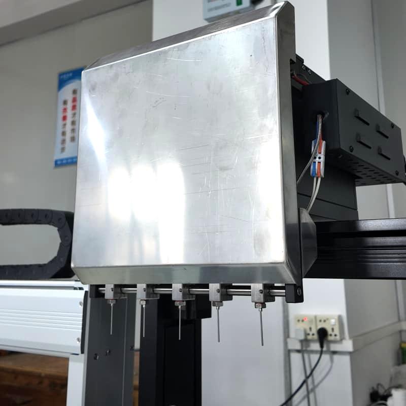 Compact CBD oil filling and capping station Compact CBD oil filling and capping station
